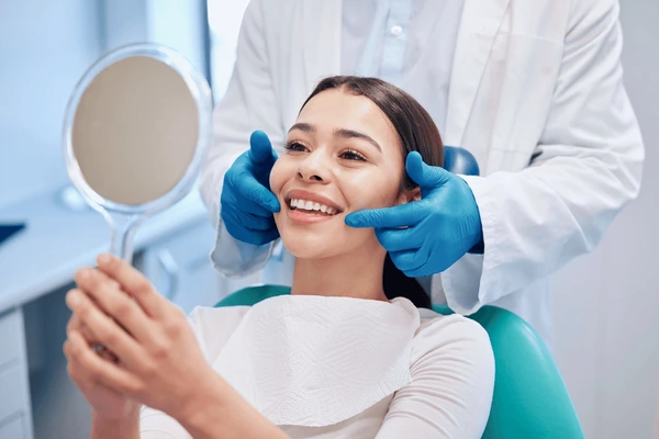 https://trudentalstudio.com/wp-content/uploads/2024/06/dentist-mirror-woman-check-smile-600nw-2308801975.webp